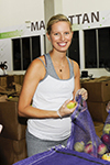 2015 09 11 - KK volunteers her labor to bag fruit with workers at City Harvest's Food Rescue Facilit (2015)
